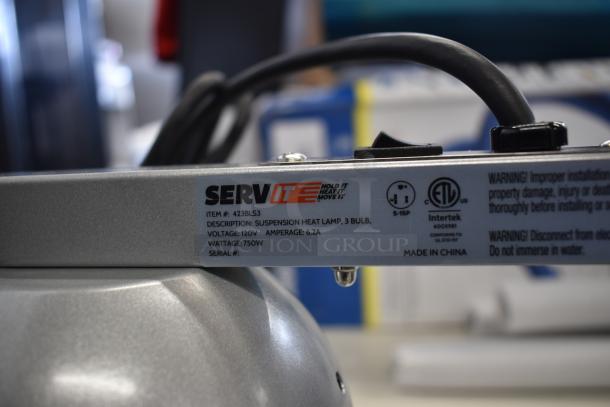 Brand new ServIt 423BLS3 suspension heat lamp, 3-bulb, 750W, 120V, scratch and dent. Features visible warning labels.