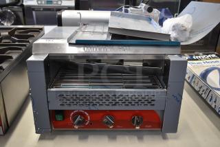 Brand new Avantco 184T3600B stainless steel conveyor toaster, 14 1/2" wide, 3" opening, 1200 slices/hour, 208V, "Caution Hot" label.