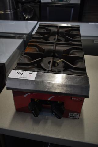 Brand new Avantco 177CAGR212 12" 2 Burner Natural Gas Range, 50,000 BTU, slight scratches, model tag visible.