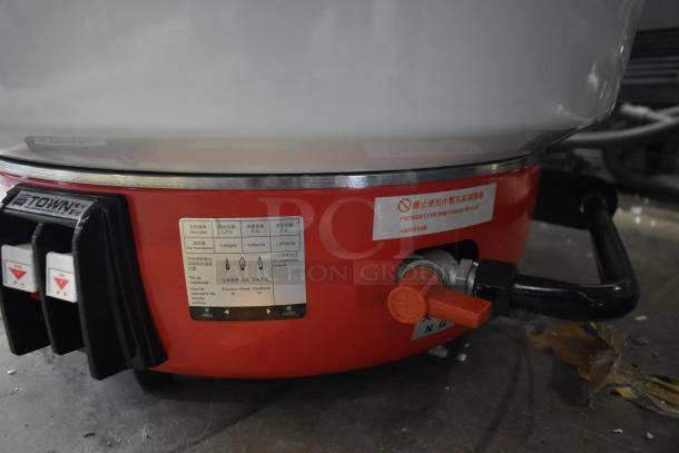 Brand new RiceMaster RS-50N-R natural gas rice cooker, 110 cup capacity, 34,600 BTU. Scratch and dent. Labels visible.