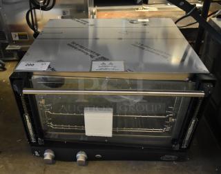 Brand new 2025 Cadco XAF013-US stainless steel convection oven; 120V, 1 Phase. Scratch and dent, tags visible.