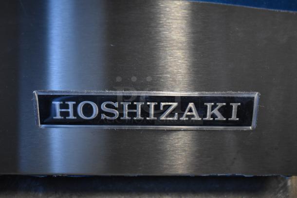 Hoshizaki AM-50BAK stainless steel ice machine, top hat style, 27 lb. bin, 54 lb. capacity, visible brand logo.