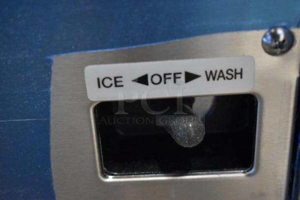 Close-up of Hoshizaki AM-50BAK ice machine control panel, showing "ICE," "OFF," and "WASH" settings, new condition.