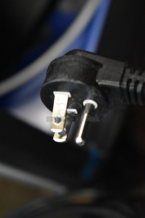 Close-up view of a power plug for a Hoshizaki AM-50BAK ice machine. Stainless steel, 27 lb bin, 115 volts.