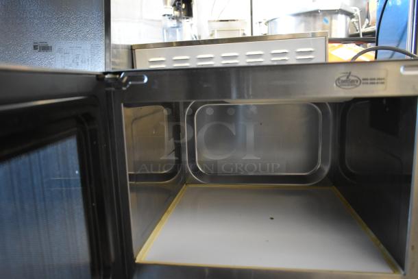 2017 Amana RCS10TS stainless steel commercial microwave, open door, spacious interior, push button controls, 120V.