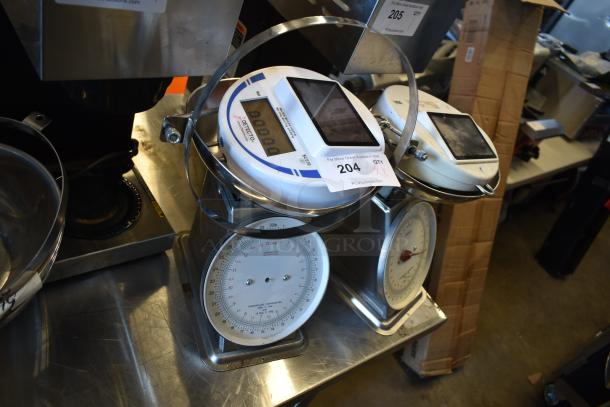 Two Cardinal Detecto SCS30 solar-powered hanging scales, 30 lb. capacity, good condition, with visible analog and digital displays.