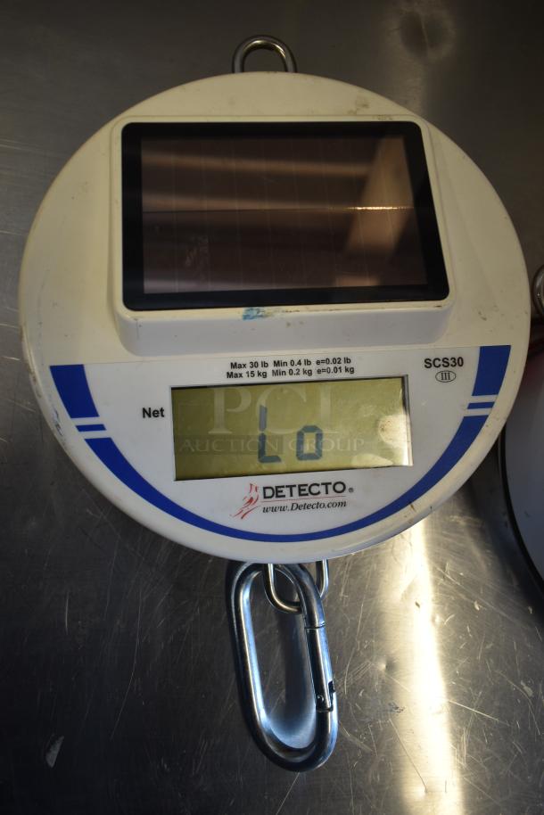 Cardinal Detecto SCS30 30 lb. solar-powered hanging scale with digital display, metal hook, in used condition.