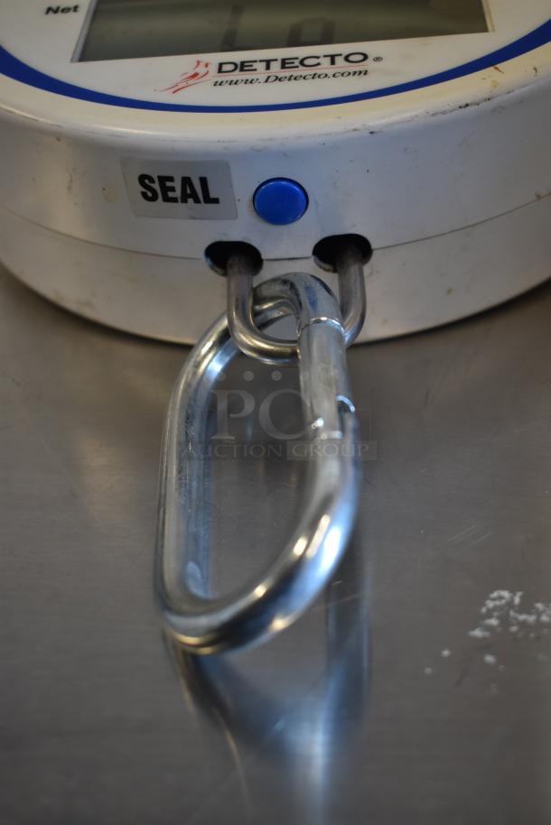 Cardinal Detecto SCS30 solar power hanging scale, 30 lb capacity, shows slight wear. Features a "SEAL" label near blue button.