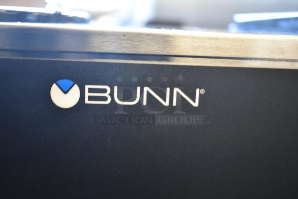 Bunn VPR coffee brewer logo on black surface, highlighting brand detail.