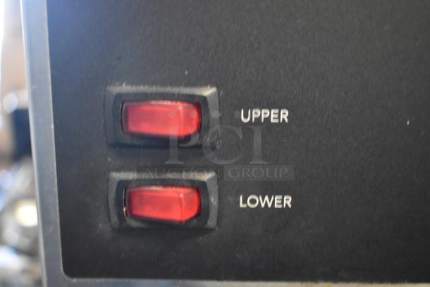 Close-up of Bunn VPR coffee brewer control panel showing two red switches labeled "Upper" and "Lower."