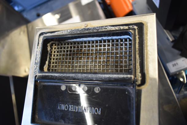 Top view of a 2021 Bunn VPR Black 12 Cup Pourover Coffee Brewer with visible water reservoir lid marked "Pour In Water Only."