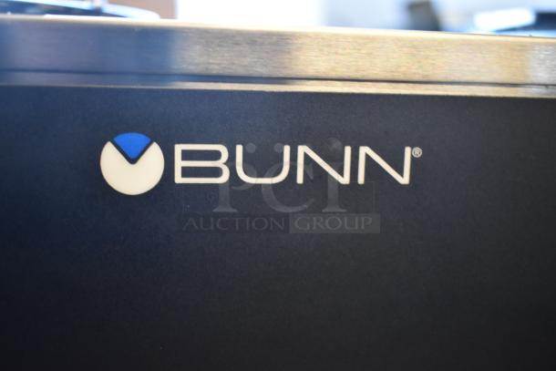 Close-up of Bunn logo on the 2021 Bunn VPR Black Coffee Brewer, featuring dual warmers and two decanters, 120 Volts, new condition.