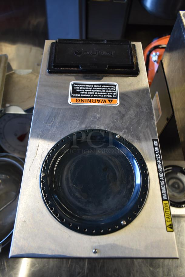 2021 Bunn VPR 12 Cup Pourover Coffee Brewer, 2 warmers, and 2 decanters. Black, 120V. Visible warning labels, good condition.