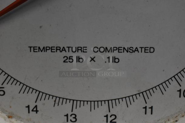 Metal countertop scale, temperature compensated, with 25 lb x 0.1 lb capacity. Used condition with clear markings.