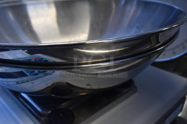 Stainless steel bowl on AND GF-300P Metal Countertop Scale, showing buttons and digital display. Good condition.