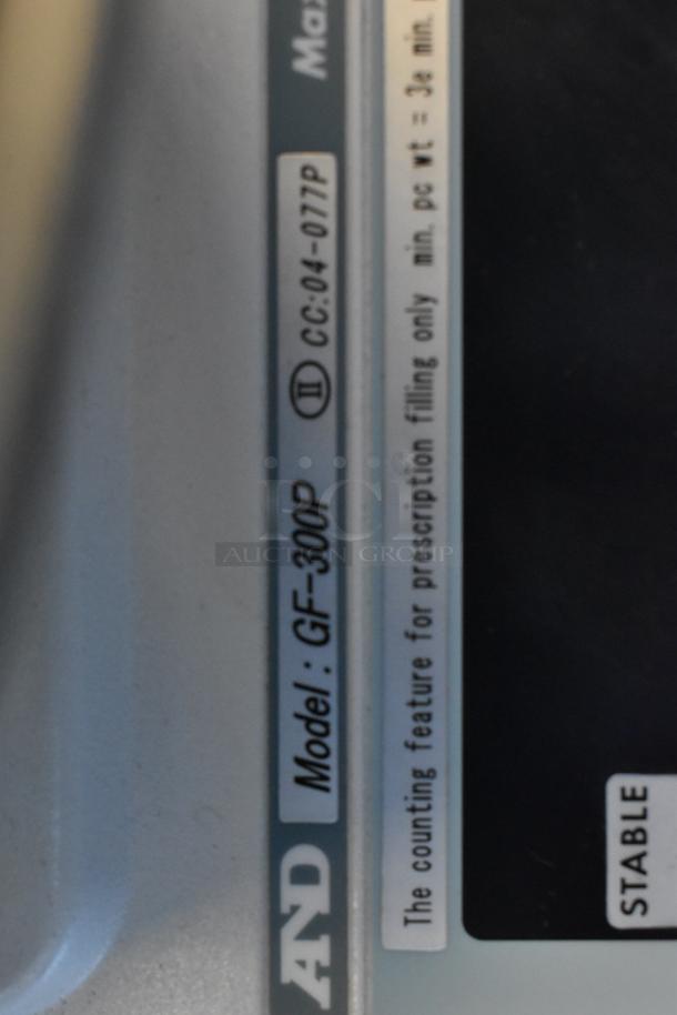 AND GF-300P Metal Countertop Scale, model details visible, used for prescription counting.