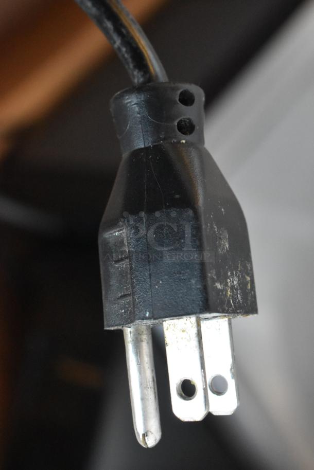 Close-up of the power plug for a Hobart HTi-7LH26 commercial food portioning scale, 120/208-240 volts.