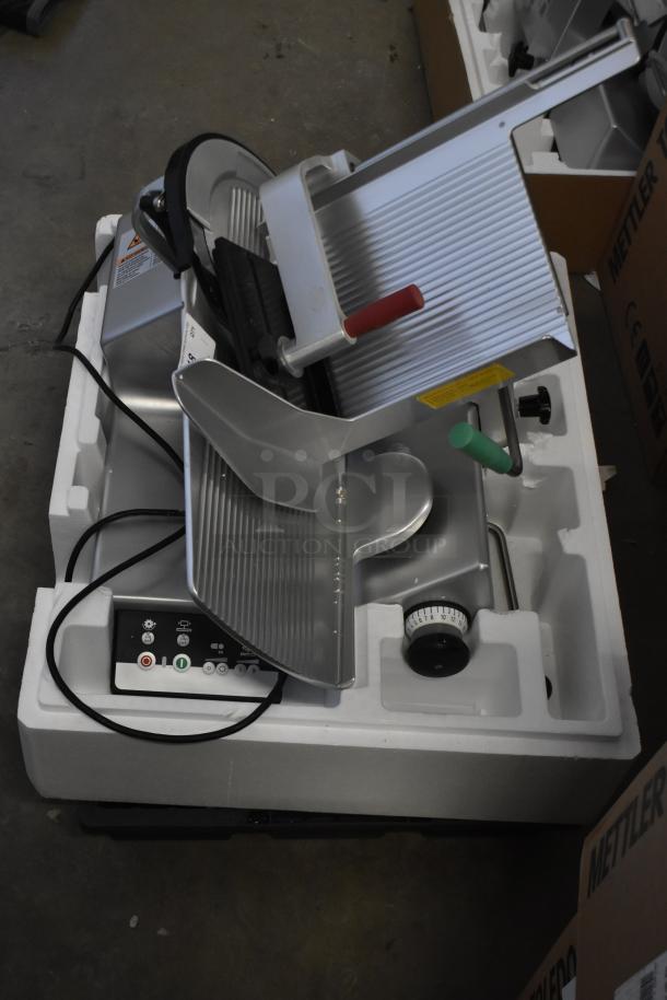 2023 Bizerba GSP HD 13" heavy-duty meat slicer, automatic gravity feed, illuminated, 120V, excellent condition.