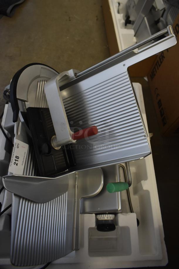 2023 Bizerba GSP HD metal commercial meat slicer, 13" blade, automatic gravity feed, 120 volts, excellent condition.