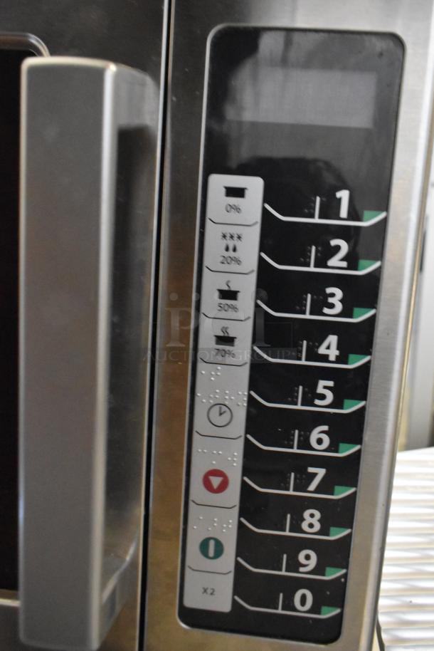 2021 Amana RCS10TS stainless steel commercial microwave, showing control panel with numeric keypad and setting options.