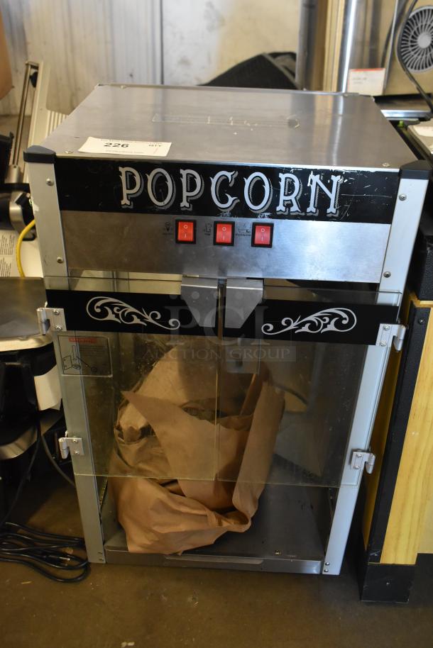 Metal commercial countertop popcorn maker merchandiser, 115 volts, 1 phase, glass doors, "POPCORN" label, fair condition.