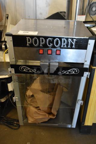 Metal commercial countertop popcorn maker merchandiser, 115 volts, 1 phase, glass doors, "POPCORN" label, fair condition.