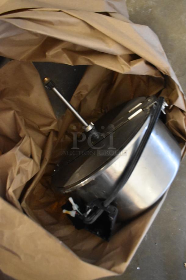 Metal commercial countertop popcorn maker in a box, 115 volts, 1 phase. Good condition with visible wiring and handles.