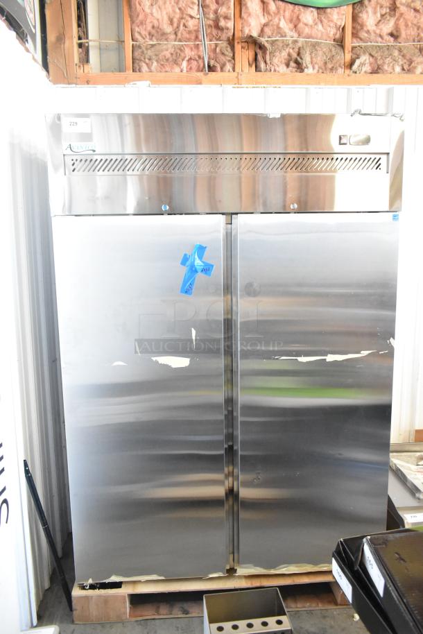 Avantco stainless steel commercial 2-door reach-in cooler, 115 volts, 1 phase, used condition with visible tape markings.