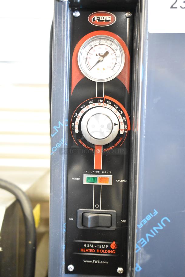 FWE TS-1633-36P stainless steel heated pizza holding cabinet control panel with temperature dial and indicator lights.