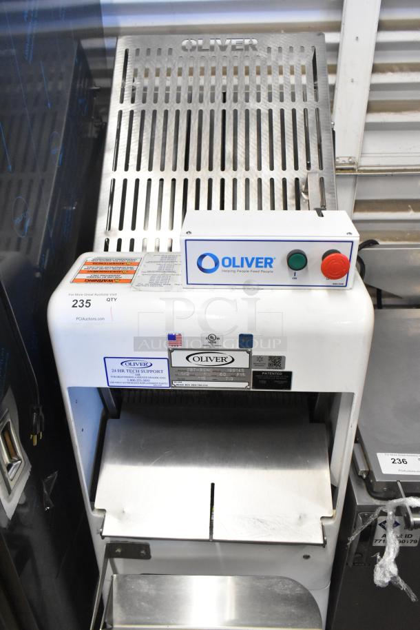 Oliver 797-32NC commercial bread loaf slicer, floor style. Features 115 volts, 1 phase. Oliver branding and control buttons visible.