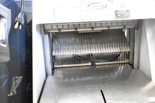Oliver 797-32NC commercial bread loaf slicer, floor style. Visible slicing blades, good condition, 115V, 1 phase.