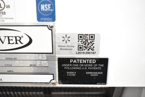 Oliver 797-32NC metal bread slicer, commercial floor style, 115V, 1 Phase. Labels indicate NSF certification and maintenance info.