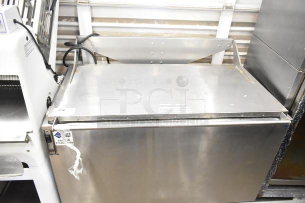 Stainless steel commercial washing/soaking tub, durable construction, labeled asset ID 7712919179, good condition.