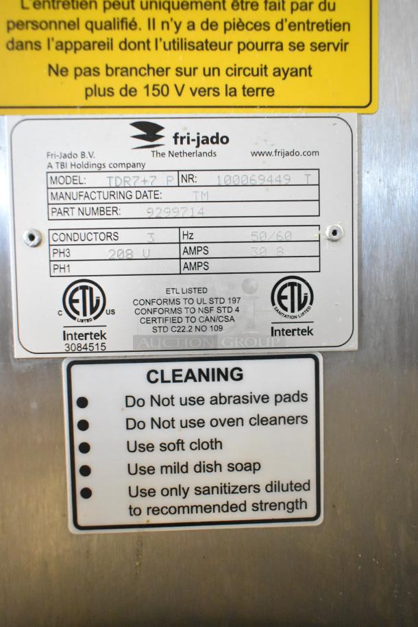 Fri-jado TDR7+7 P stainless steel rotisserie ovens, electric, 208V, 3-phase. Broken glass on bottom oven noted.