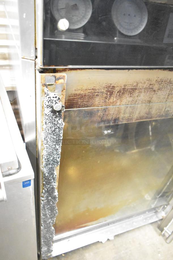 Fri-jado TDR7+7 P stainless steel rotisserie oven, electric, floor style, visible broken glass on bottom, 208V, 3 phase.