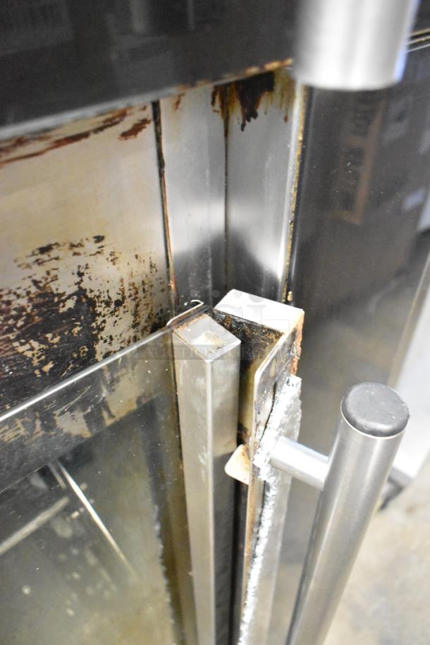 Fri-jado TDR7+7 P rotisserie oven door; visible rust and wear, broken glass noted, stainless steel handle.
