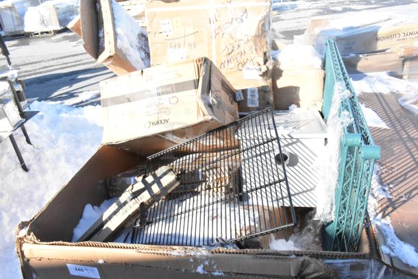 Auction lot with 12 new scratch and dent items, including fryer and chafer, in boxes on snowy ground.