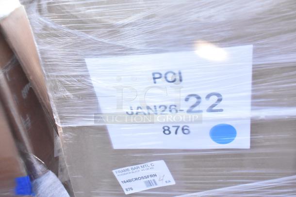 Pallet wrapped with items labeled "PCI JAN26-22 876." Contains scratch and dent items, including a tabletop and vinyl padded seats.