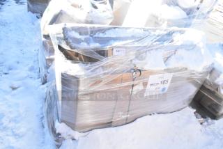 Five wrapped, brand new scratch and dent items, including a sink and overshelves, partially covered in snow, labeled "DEC25-165."