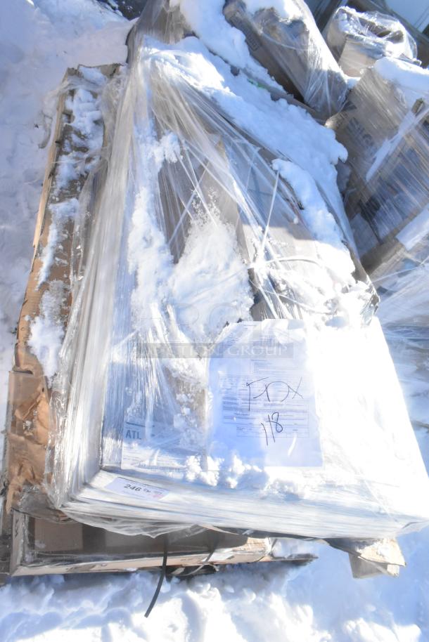 Pallet of 8 new scratch and dent items, including Hatco warming drawer, Avantco overshelf, wrapped in plastic with labels.