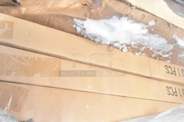 Cardboard boxes with 8 new scratch and dent items, including Hatco warming drawer and Avantco overshelf, visible snow on packaging.