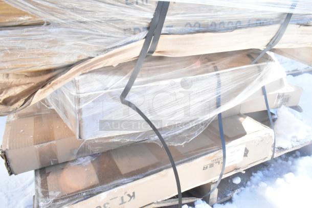 Plastic-wrapped pallet with multiple boxed items, including Hatco warming drawer and Avantco over shelf. New, scratch and dent condition.