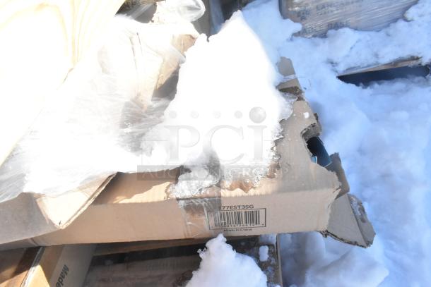 Cardboard box labeled "Made in China" with SKU 177EST3SG, partially covered in snow.