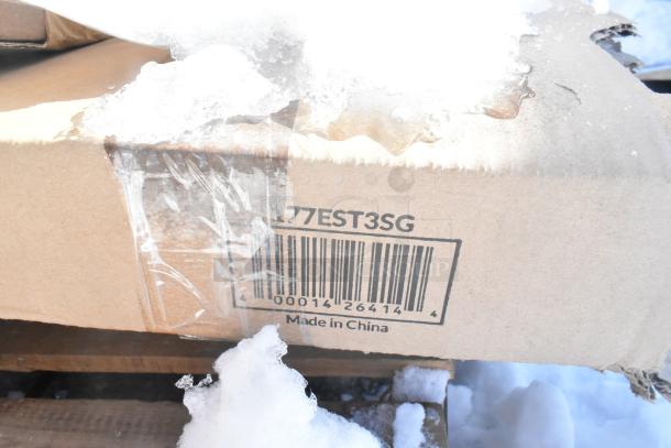 Cardboard box labeled "Made in China" with scratch and dent marks, featuring a barcode and snow on top.