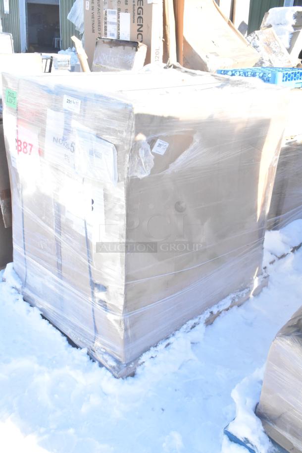 Large pallet of boxed items, including an upright bagged vacuum cleaner and Avantco rice cooker. Boxes show wear; items are new.