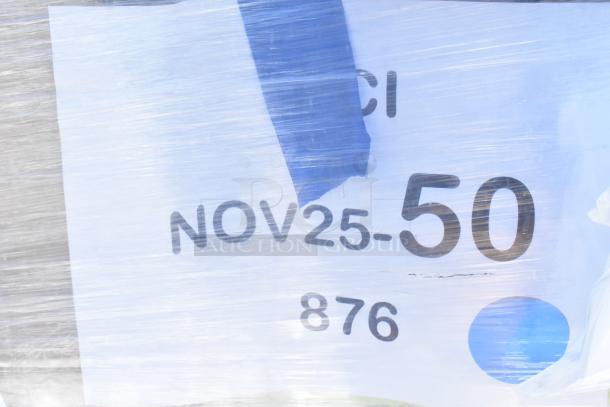 Packaged auction lot with visible label reading "NOV25-50" and "876." Contains new scratch-and-dent upright bagged vacuum and Avantco rice cooker.
