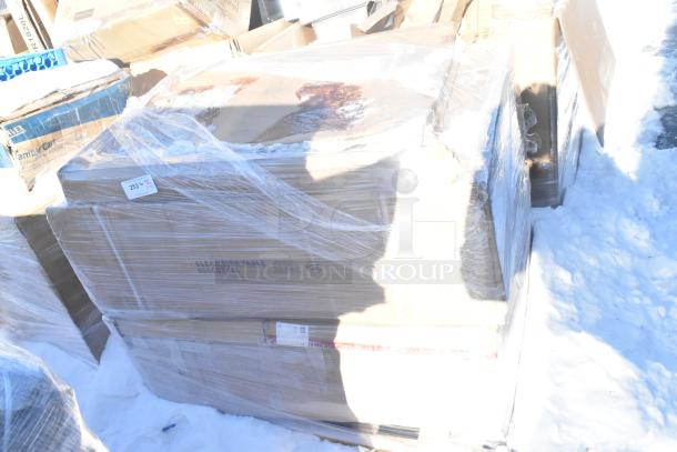 Stack of wrapped boxes containing brand new scratch and dent items, including dirty dish tables and cake pans, labeled "Clean Dish Table 600 CDT 48L."