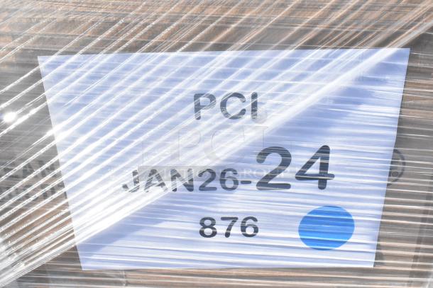 Plastic-wrapped package labeled "PCI JAN26-24 876" with visible scratch and dent kitchen items inside.