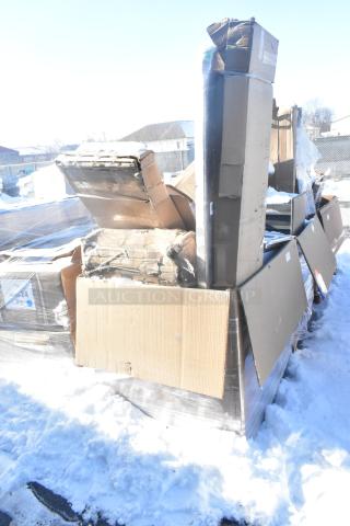 Pallet with 12 new scratch and dent items, including sink and bar stool, in boxes on snow.