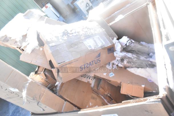 Boxes of new scratch and dent items including a sink, bar stool, table base plate, and pot rack. Stratus labels visible.